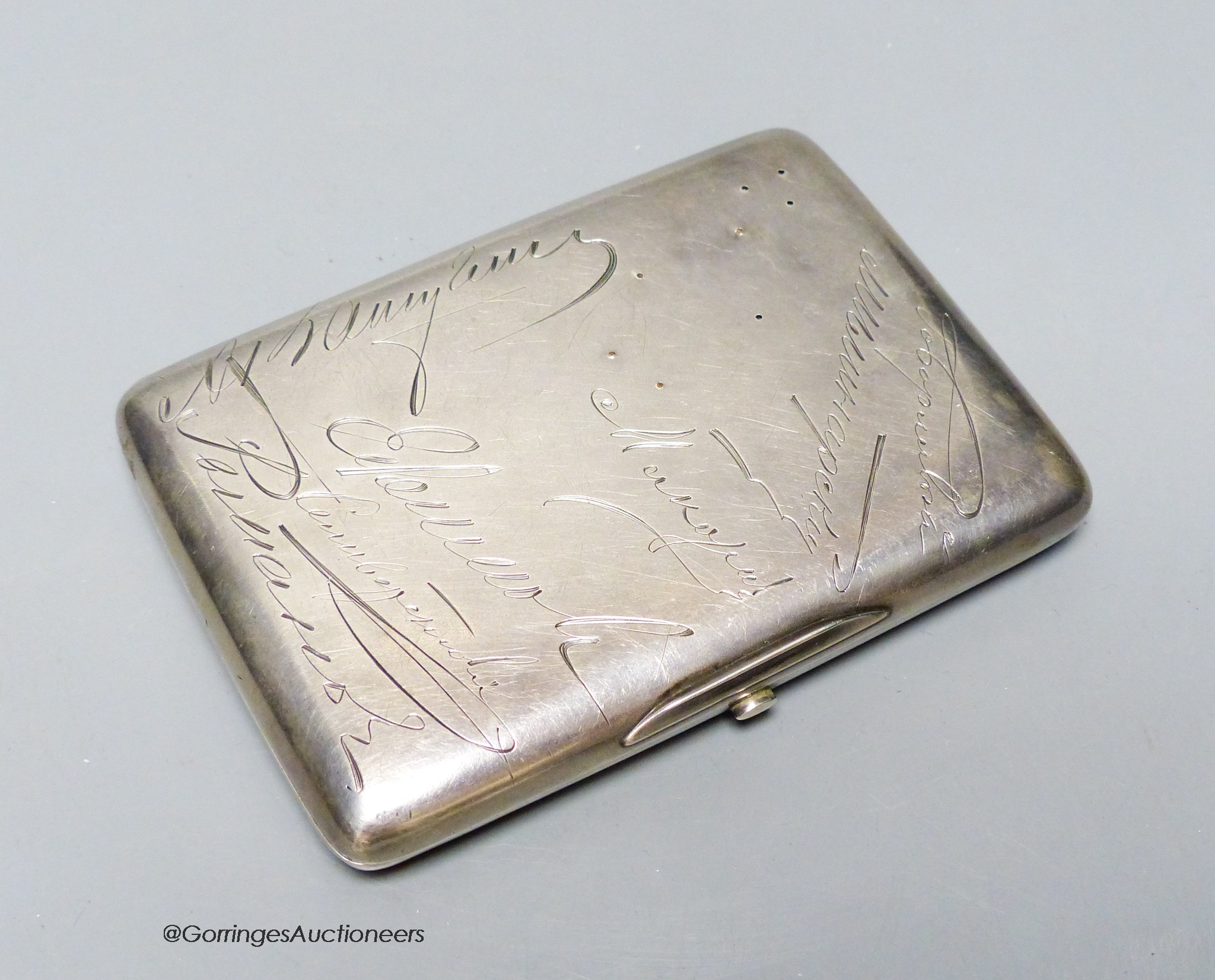 An early 20th century Russian 84 zolotnik cigarette case, presented to V.P. Nikolaev (in command of the Russian port of Kronstadt) and engraved with the signatures of colleagues, 11.4cm.